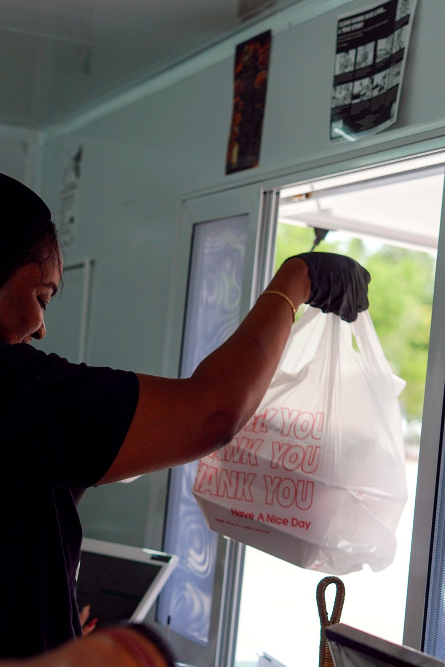 Handing food to customer